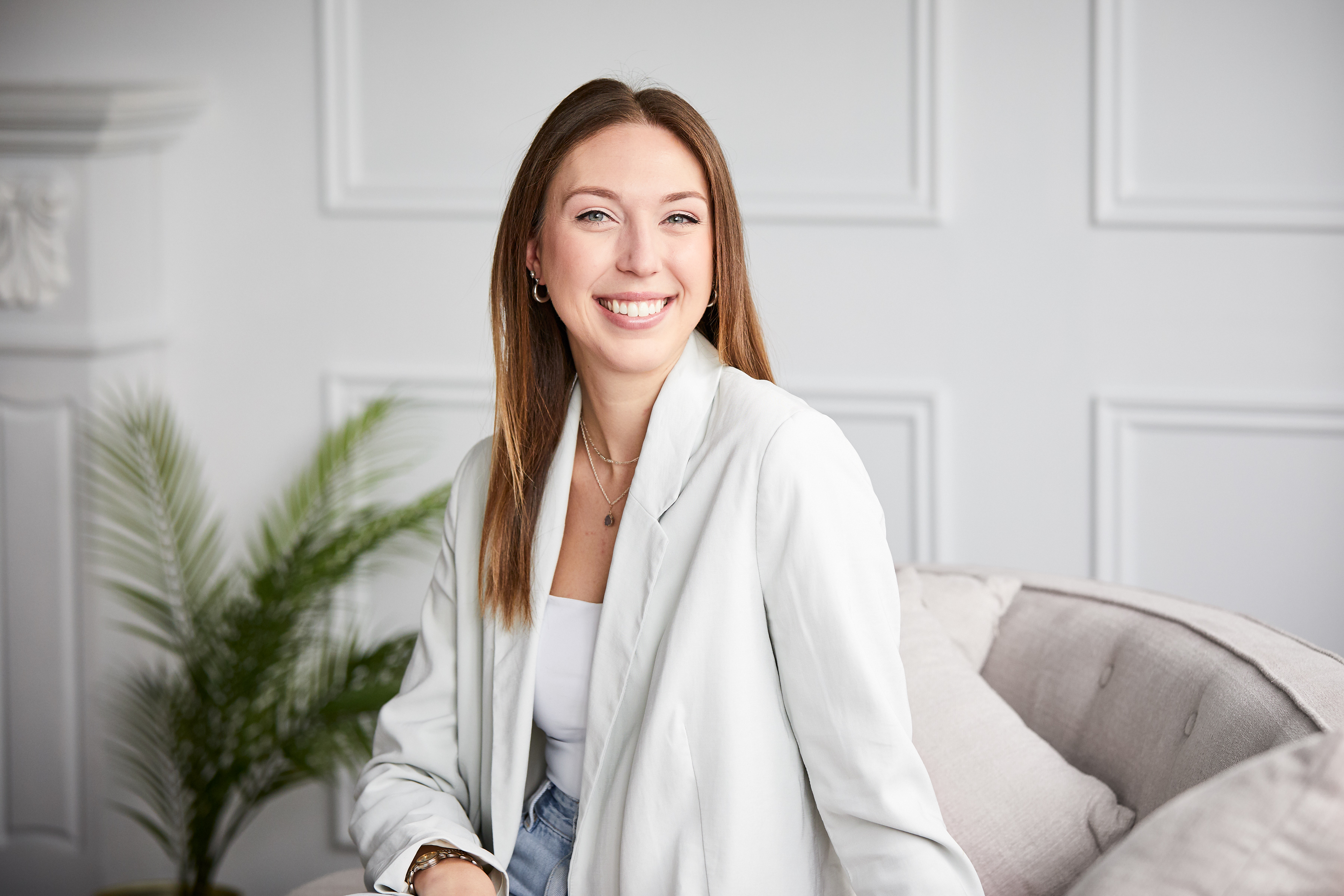 Abbie smiling to the camera during a business photoshoot